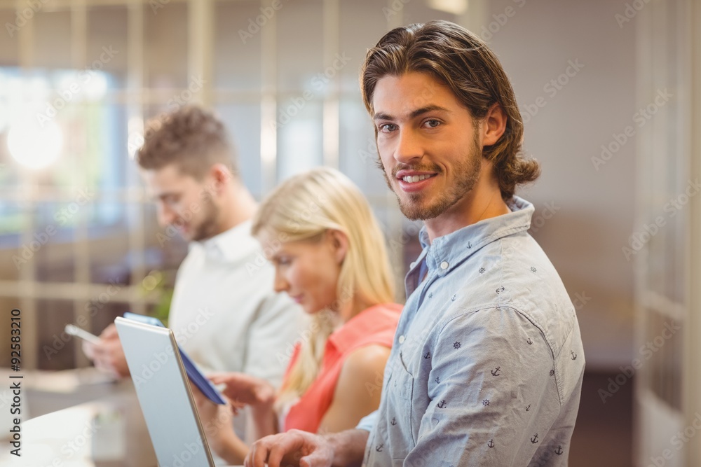 Businessman with colleagues working in office Businessman with colleagues working in office