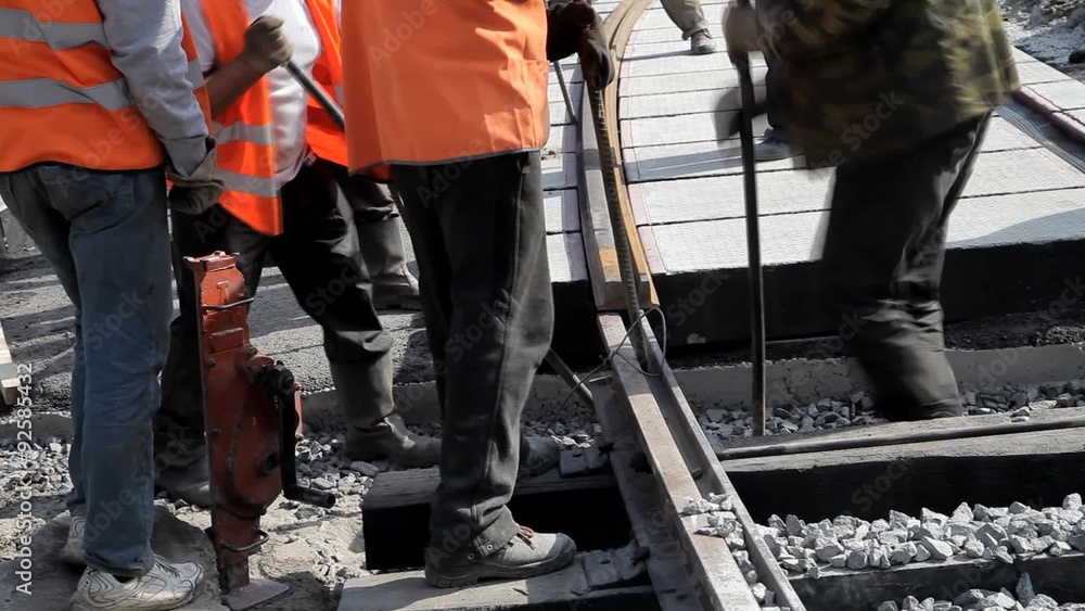 Railway workers bolting track rail Railway workers bolting track rail