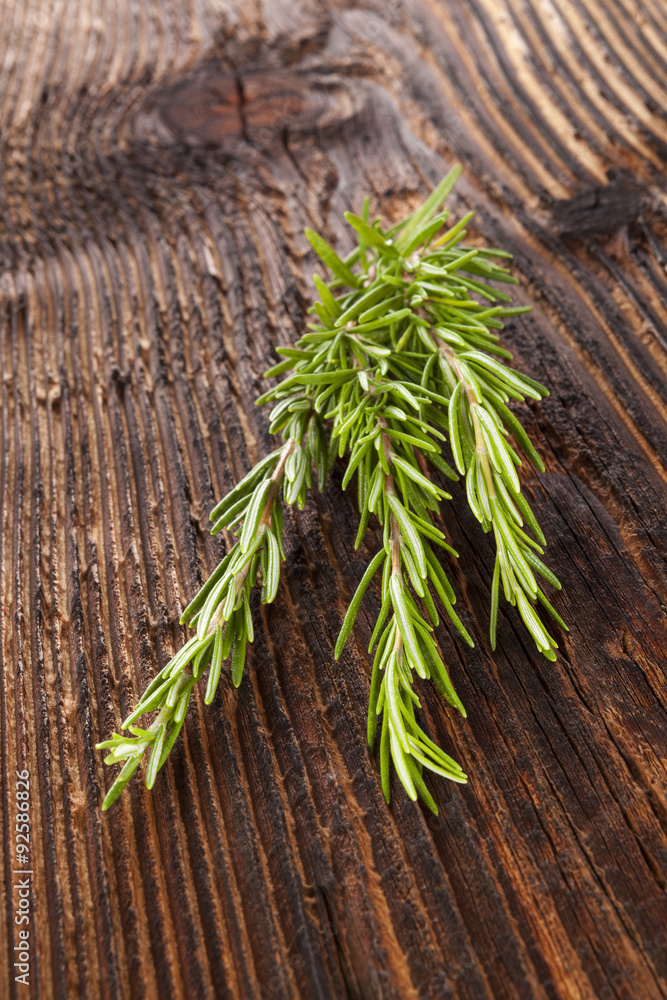 Rosemary on wooden table.