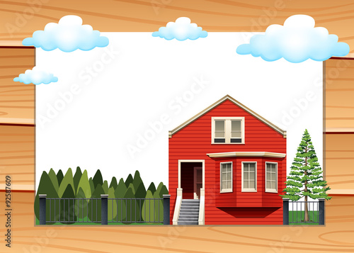 Red house on the wooden wall