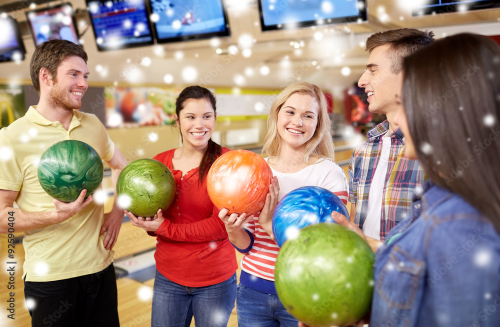 happy friends in bowling club at winter season happy friends in bowling club at winter season