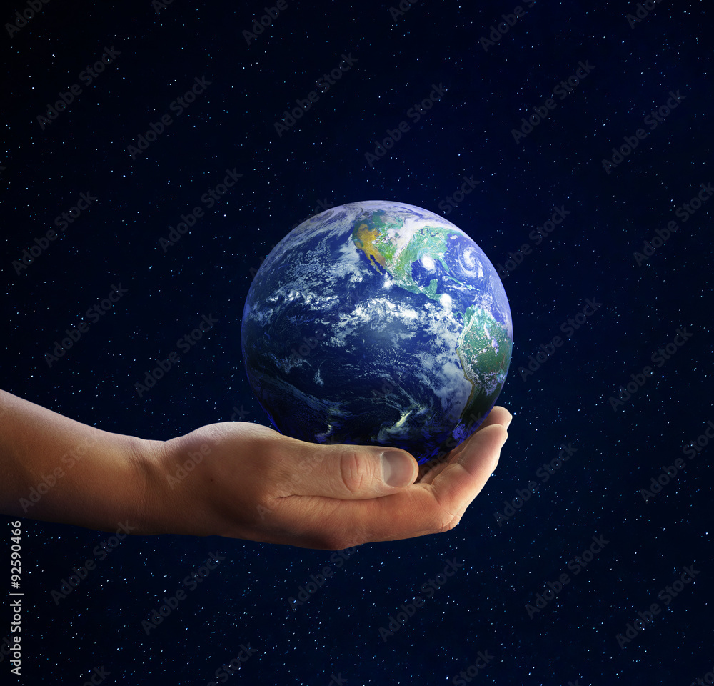 Planet earth on palm and space background. Conceptual Image. Elements of this image furnished by NASA Planet earth on palm and space background. Conceptual Image. Elements of this image furnished by NASA