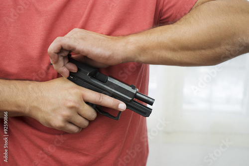 Man load a gun pistol