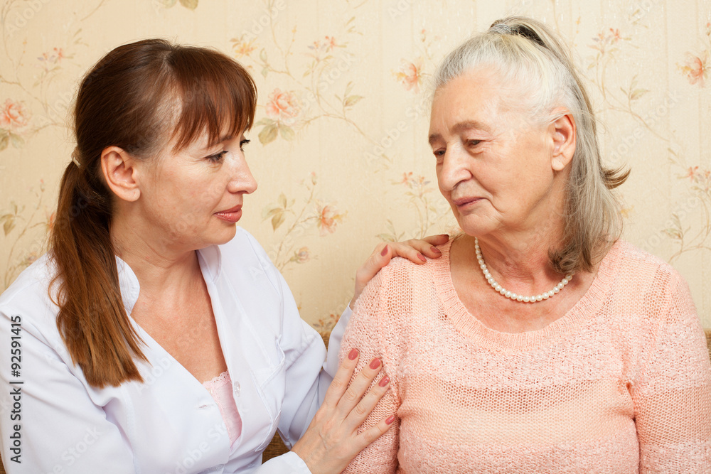 Doctor explaining diagnosis to his female patient Doctor explaining diagnosis to his female patient