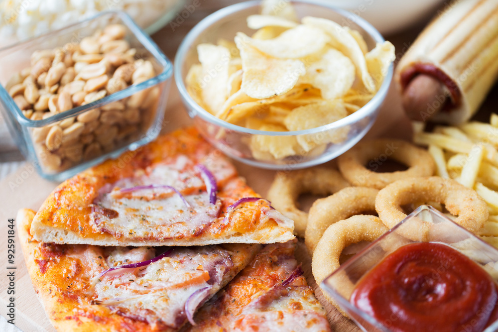 close up of fast food snacks on wooden table