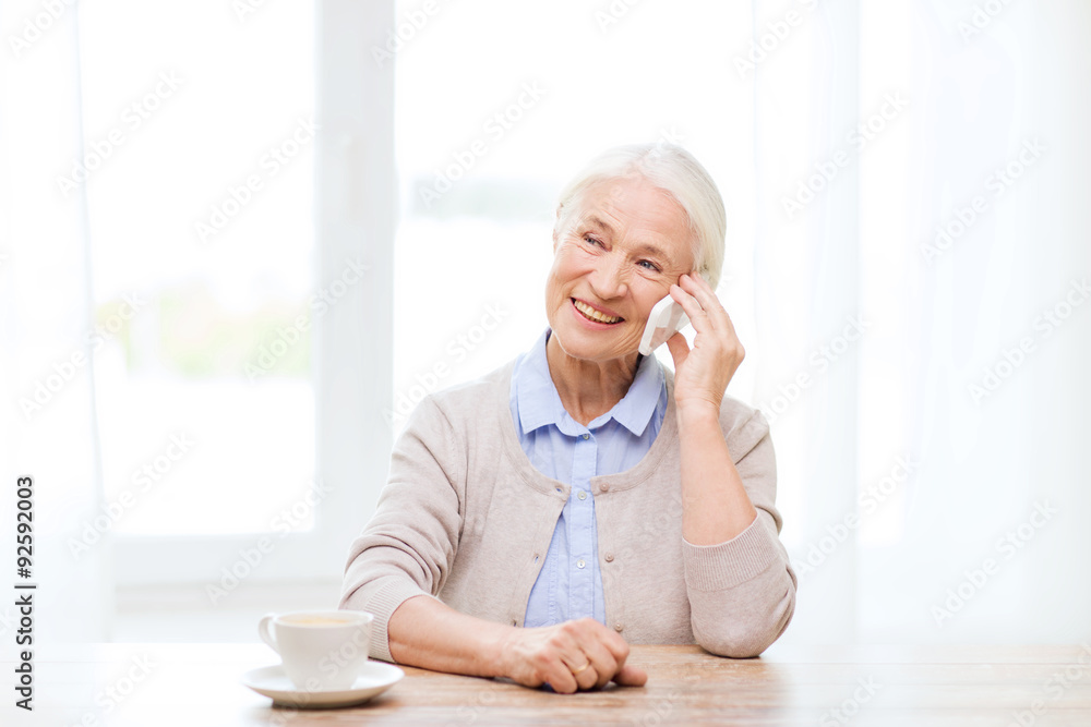 senior woman with smartphone calling at home senior woman with smartphone calling at home