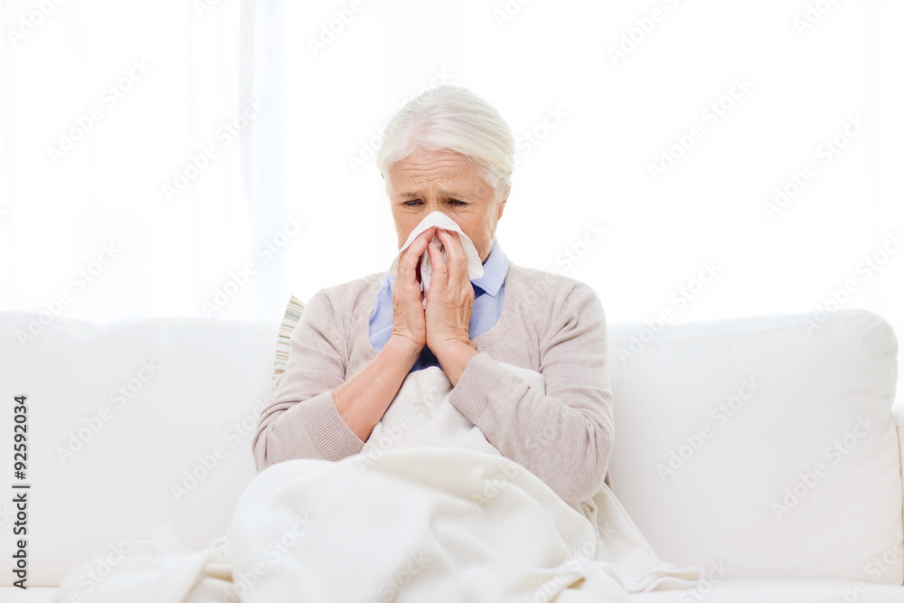 sick senior woman blowing nose to paper napkin sick senior woman blowing nose to paper napkin