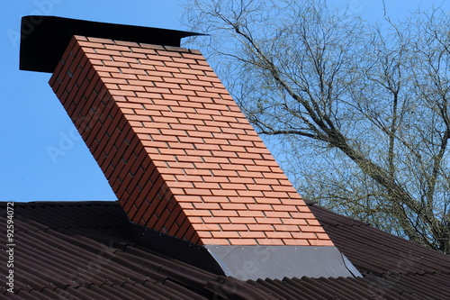 Red brick chimney on the roof