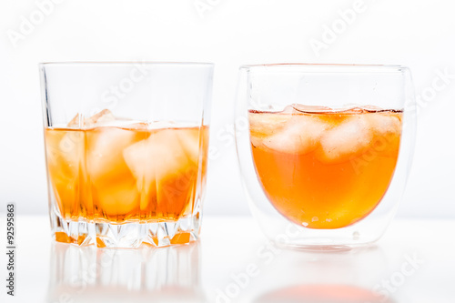 Two different glasses of whiskey 