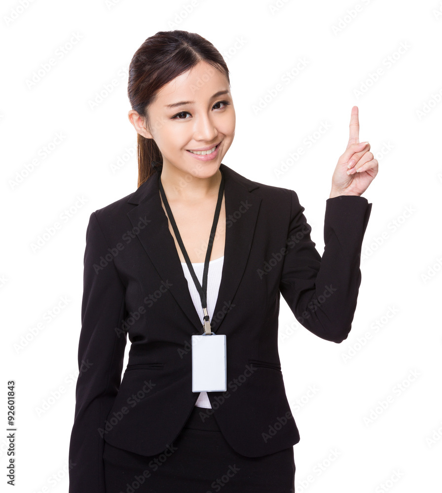 Asian young businesswoman hold wih name badge and finger point u Asian young businesswoman hold wih name badge and finger point u