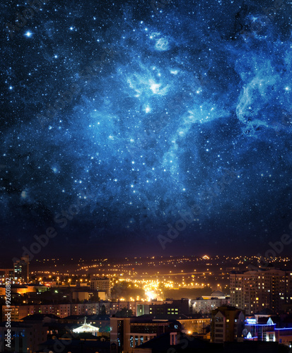 Fototapeta Naklejka Na Ścianę i Meble -  City landscape at nigh with sky filled with stars. Elements of this image furnished by NASA.