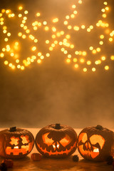 Illuminated carved halloween pumpkins lanterns