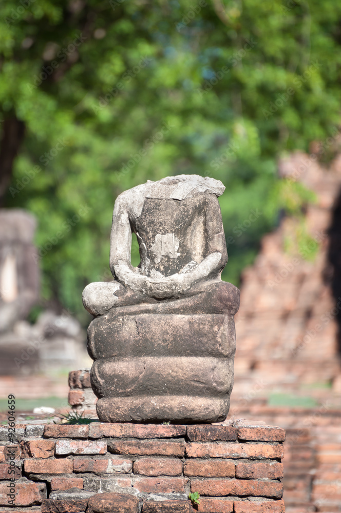 Small broken Buddha statue at Wat Mahathat temple, Ayutthaya, Thailand Small broken Buddha statue at Wat Mahathat temple, Ayutthaya, Thailand