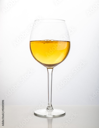 Glass of wine on a white background
