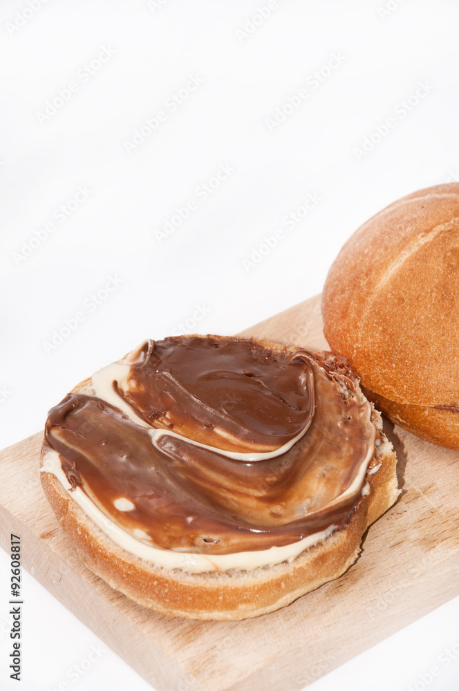Donuts with chocolate cream on the wooden board Donuts with chocolate cream on the wooden board