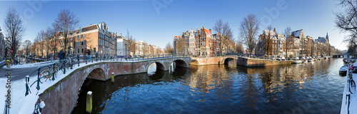 Beautiful winter panorama of the Unesco world heritage city canals of Amsterdam, The Netherlands.