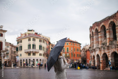 Girl on the area in the autumn in Verona