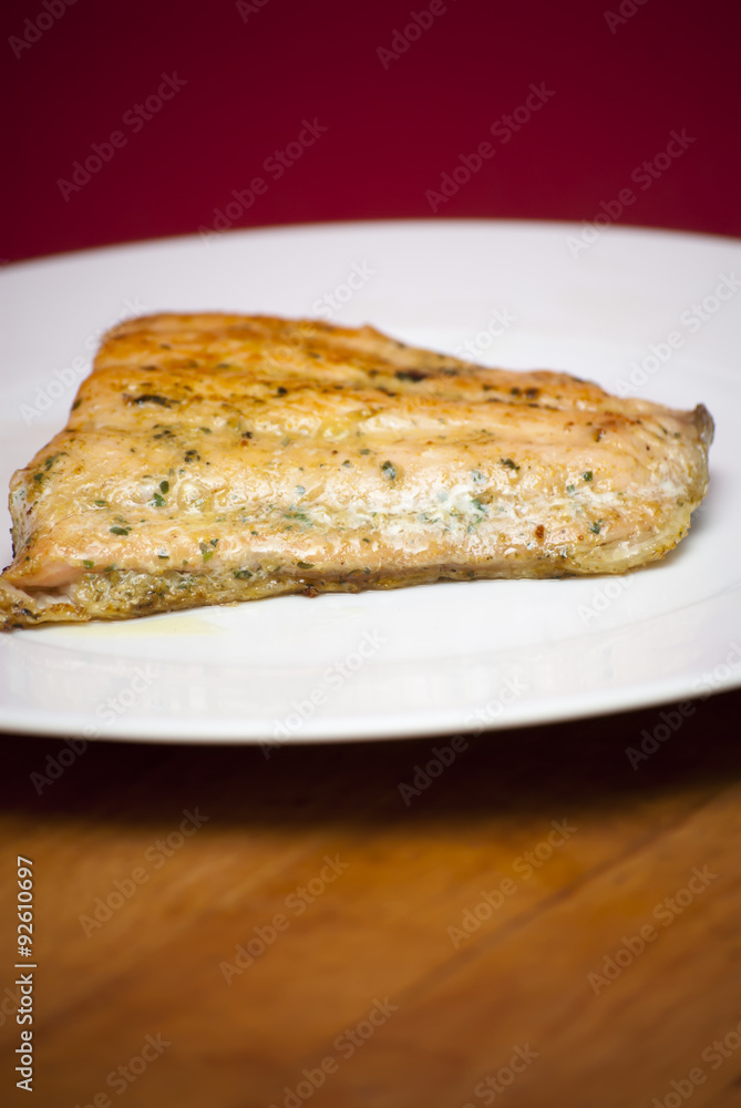Grilled salmon on a white plate