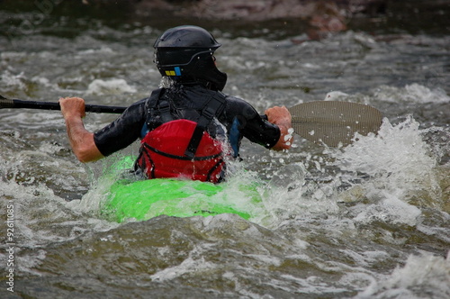 Kayaker training on a rough water. Southern Bug river, Ukraine.