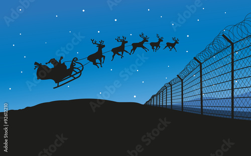 Weihnachtsmann fliegt mit seinem Schlitten über Grenzzaun
