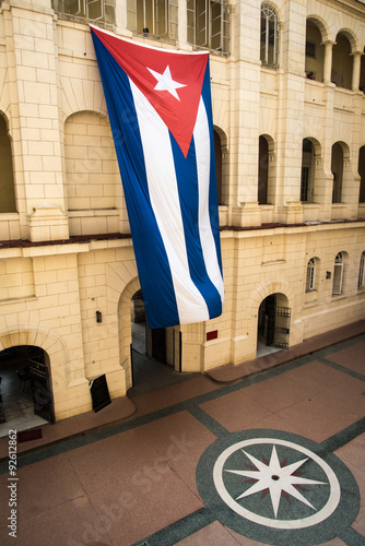 Cuban flag on colonial building in Havana, Cuba