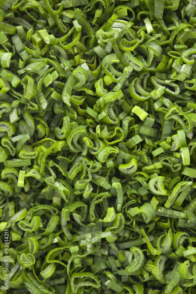 Chopped scallion leaves background. Top view of lots of chopped scallion leaves. Chopped scallion leaves background. Top view of lots of chopped scallion leaves.