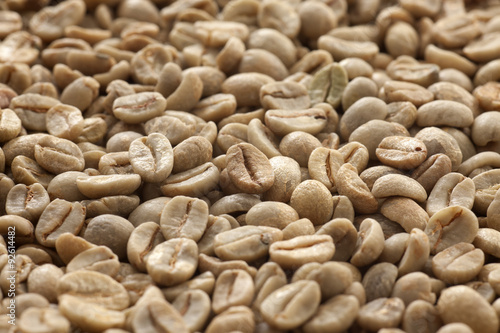 Raw coffee beans. Closeup view of raw coffee beans. 