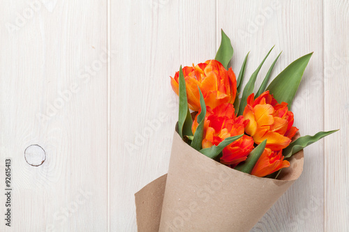 Fototapeta Naklejka Na Ścianę i Meble -  Colorful tulips over wooden table