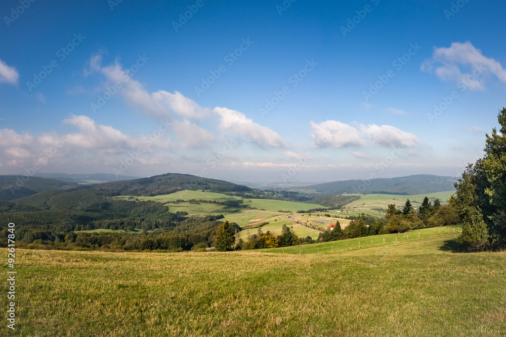 Amazing summer countryside under blue sky with clouds
