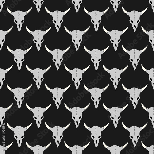 Horned bull skulls seamless pattern. Illustration of bull or cow skulls on a black background.