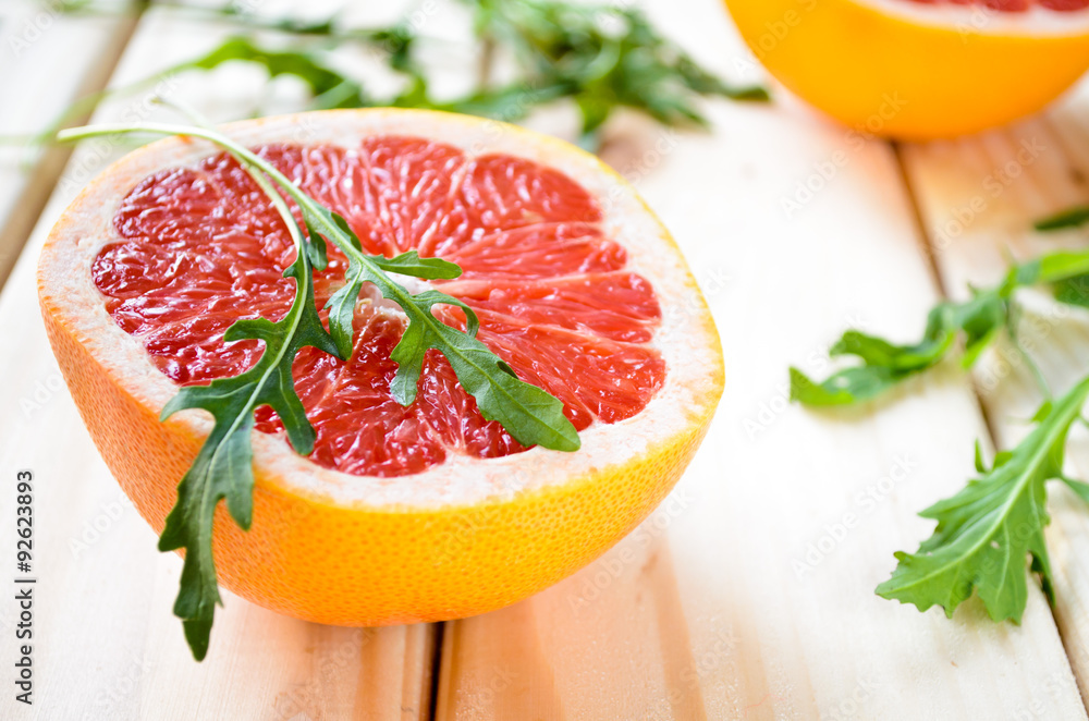 Grapefruit with fresh arugula leaves Grapefruit with fresh arugula leaves