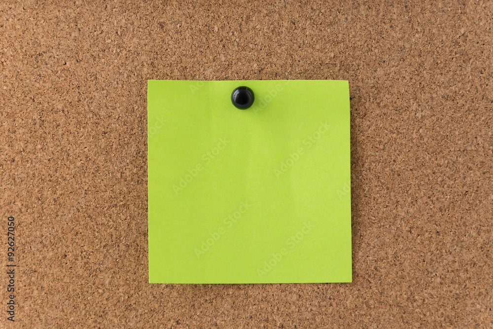sticky note on cork board sticky note on cork board