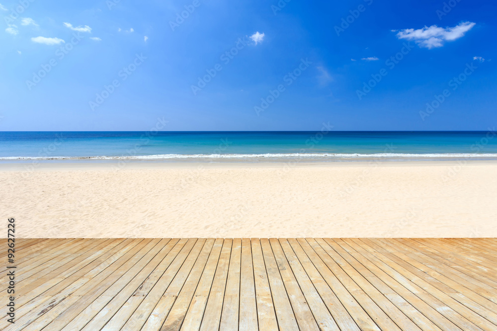 Fototapeta premium Empty top of wooden decking and view of tropical beach