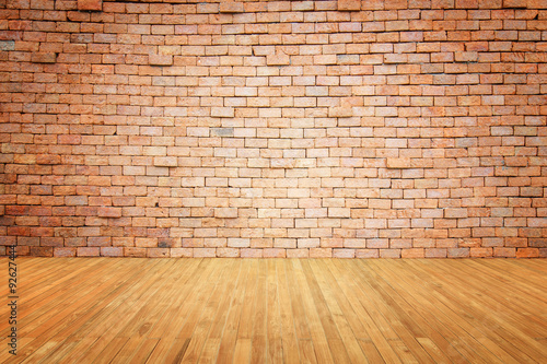 Empty top of wooden floor and natural stone wall