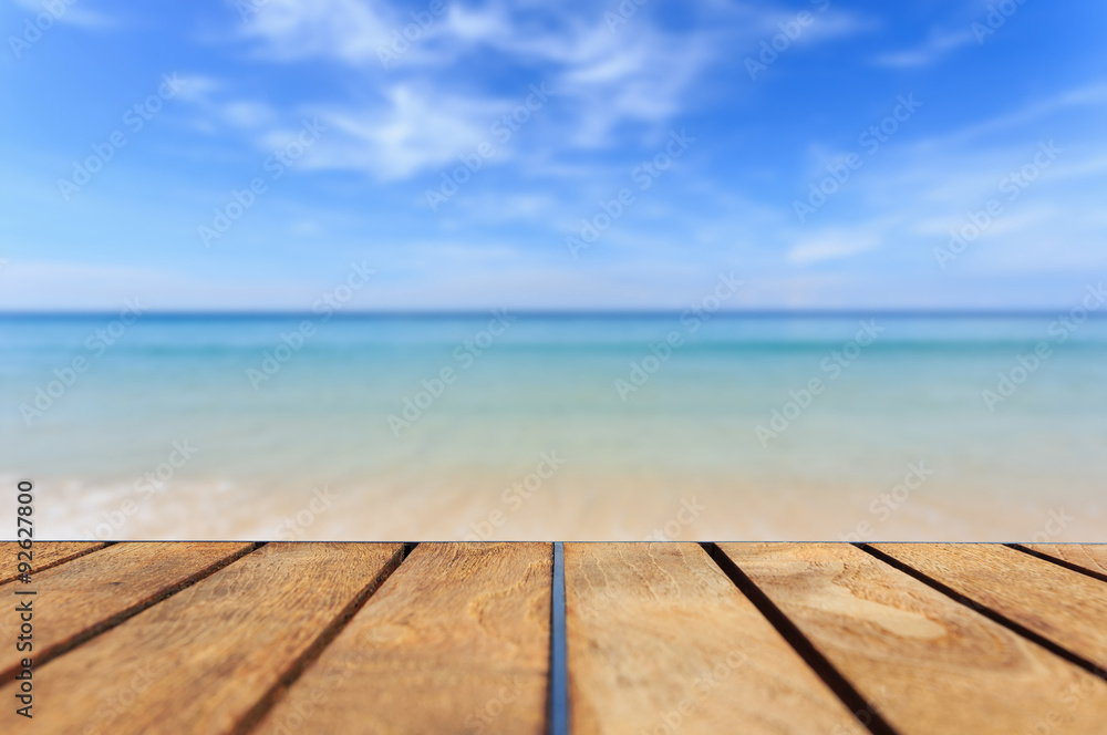 Top of teak wood table and view of sea and blue sky Top of teak wood table and view of sea and blue sky