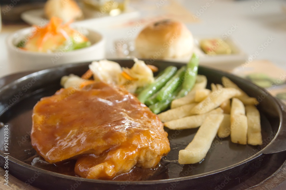 steak and chips on black plate steak and chips on black plate