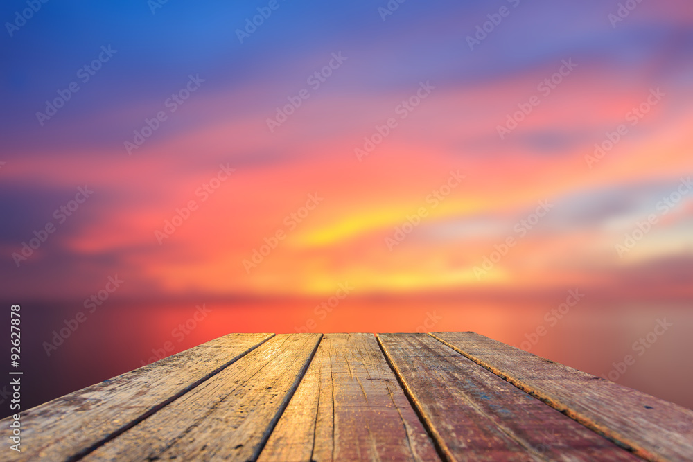 Top of old wooden table with blur sunset  background