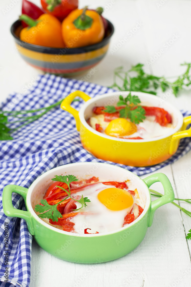 Baked eggs with cheese, tomatoes and peppers. Baked eggs with cheese, tomatoes and peppers.