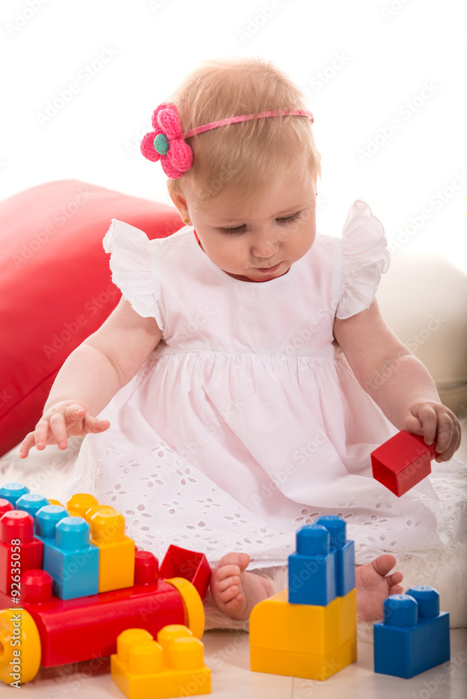 Baby girl playing with cubes toys Baby girl playing with cubes toys