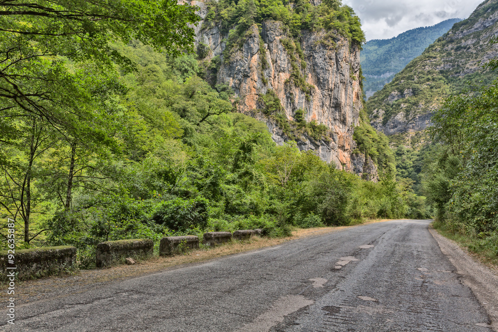Asphalt road by mountain gorge