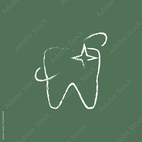 Shining tooth icon drawn in chalk.