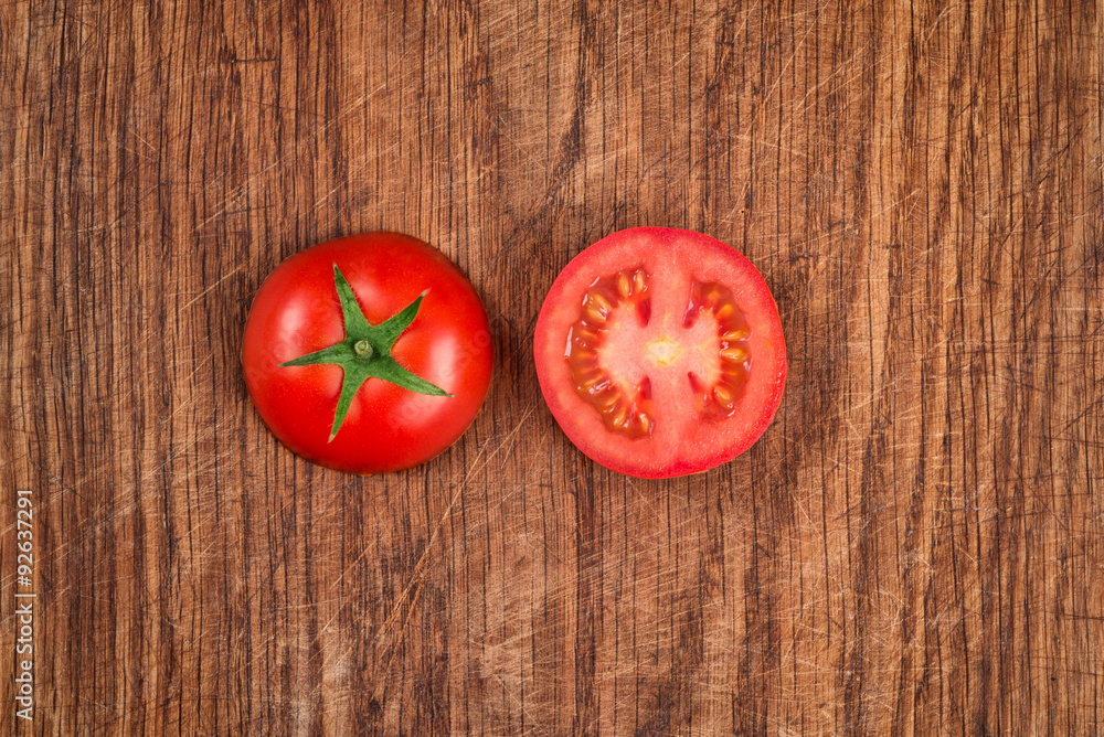 tomatoes on wooden cutting board top view Stock Photo | Adobe Stock