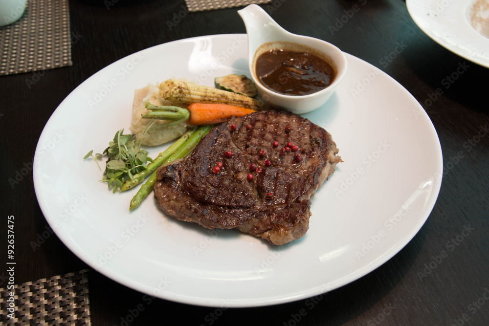 Grilled steaks with Pepper sauce and vegetables Grilled steaks with Pepper sauce and vegetables