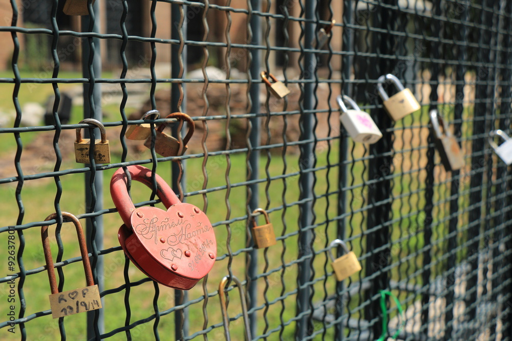 Locks hanging on the fence. Small DOF Locks hanging on the fence. Small DOF