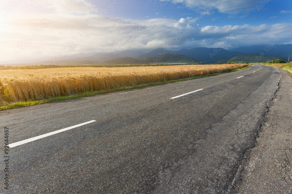 Driving on open road against the sunlight