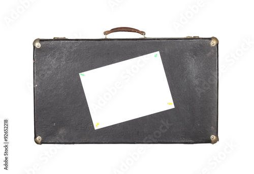 Old black suitcase isolated on white background with empty blank