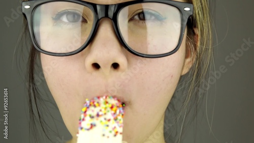 Beautiful woman with black sunglasses sexy eating banana