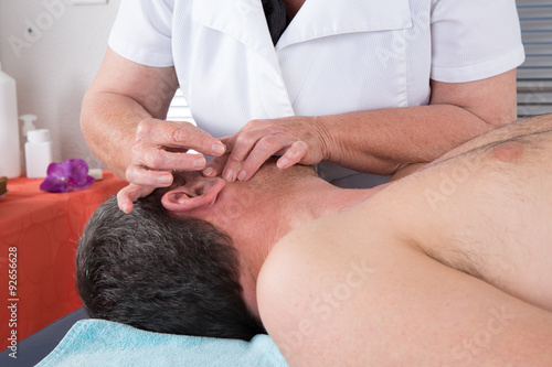 Man in an acupuncture therapy at the health spa