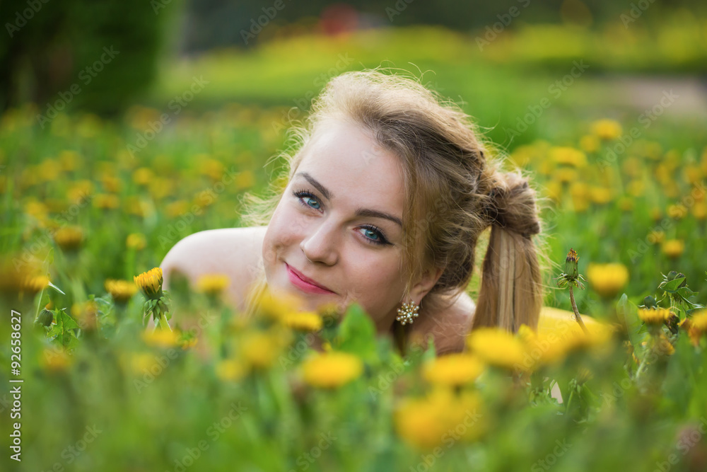 Portrait of the girl in dandelions Portrait of the girl in dandelions