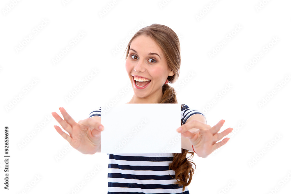 Student girl showing white blank sheet - copy space, isolated over background Student girl showing white blank sheet - copy space, isolated over background